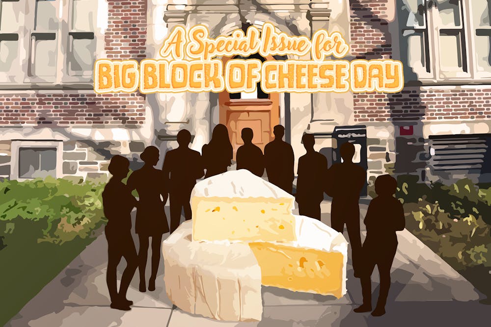 The front of The Daily Princetonian office.  A number of people in black silhouettes are standing around a big block of cheese with a slice cut out of it.