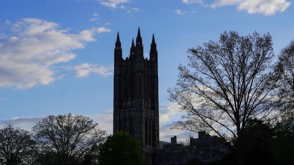 The graduate tower during the day with a shadow cast over it.