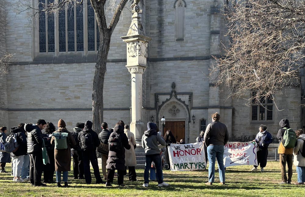 People gathered with a sign "we will honor our martyrs."
