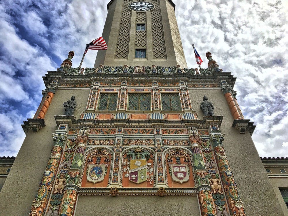 The main tower at University of Puerto Rico includes the emblem of Harvard University.