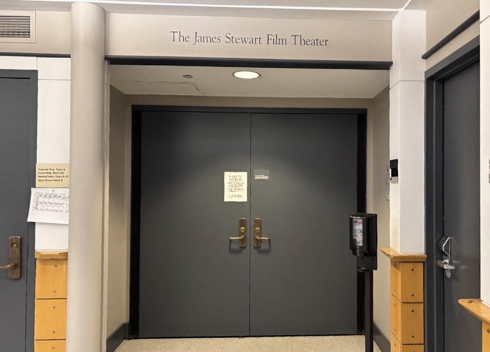 Grey double-door entrance with "The James Stewart Film Theater" written above it.