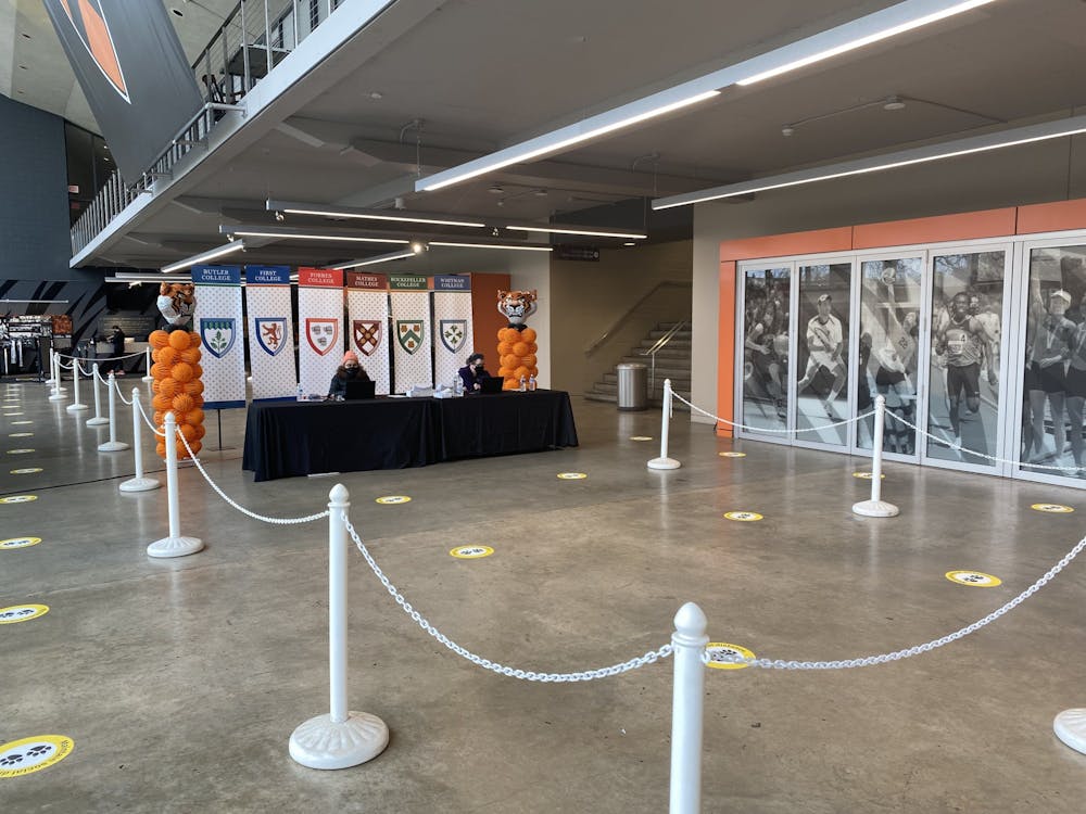 <h5>A check-in desk for students arriving at Jadwin Gym to take their first on-campus COVID-19 test.</h5>
<h6>Zachary Shevin / The Daily Princetonian</h6>