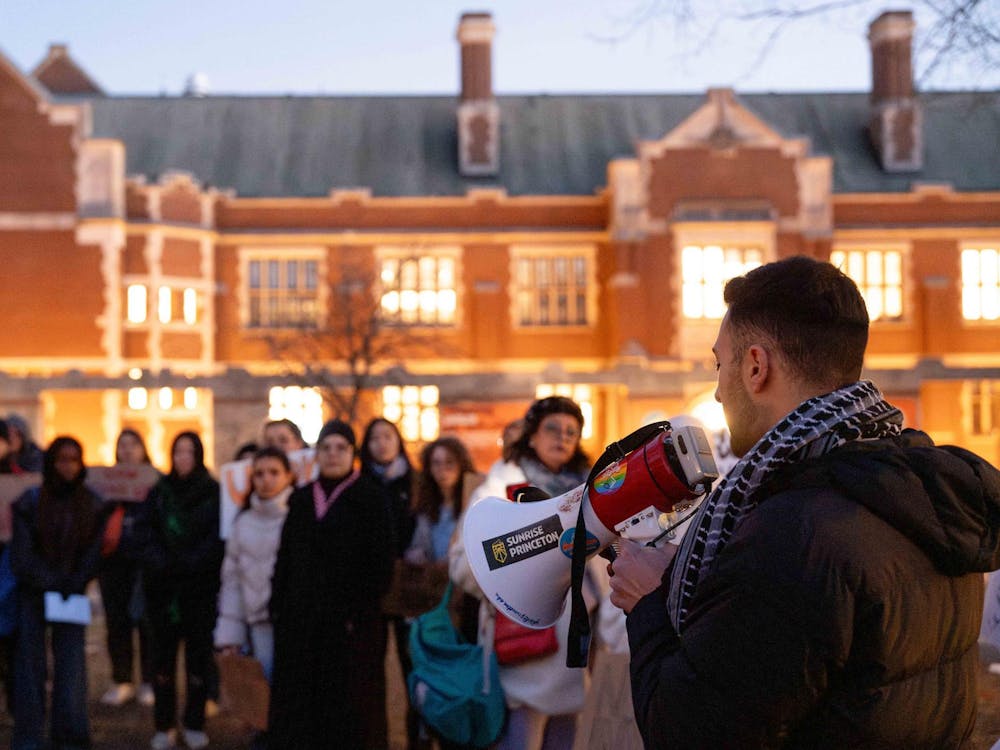 Students and community members stand in front of Frist.