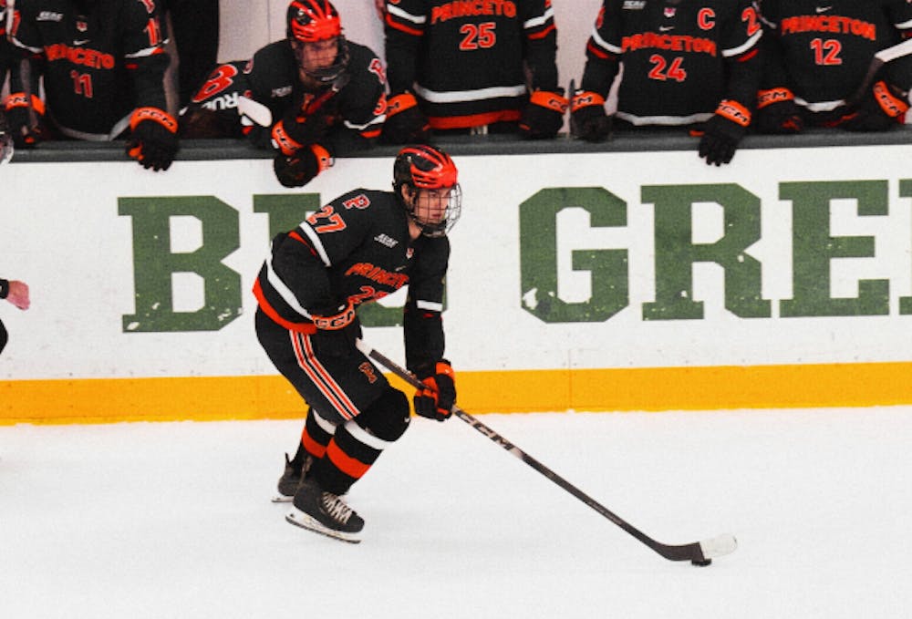 Princeton hockey player skating.