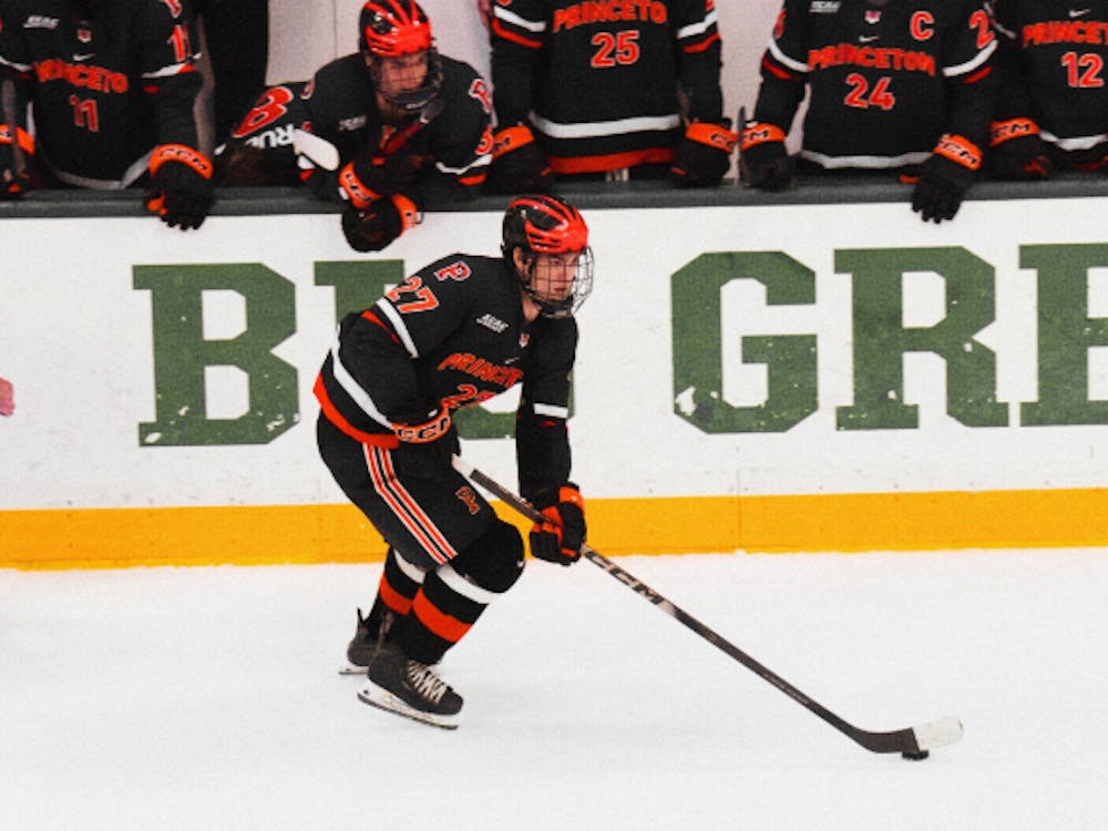 Princeton hockey player skating.