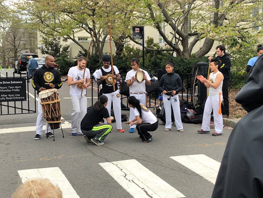 Student performing on Nassau Street