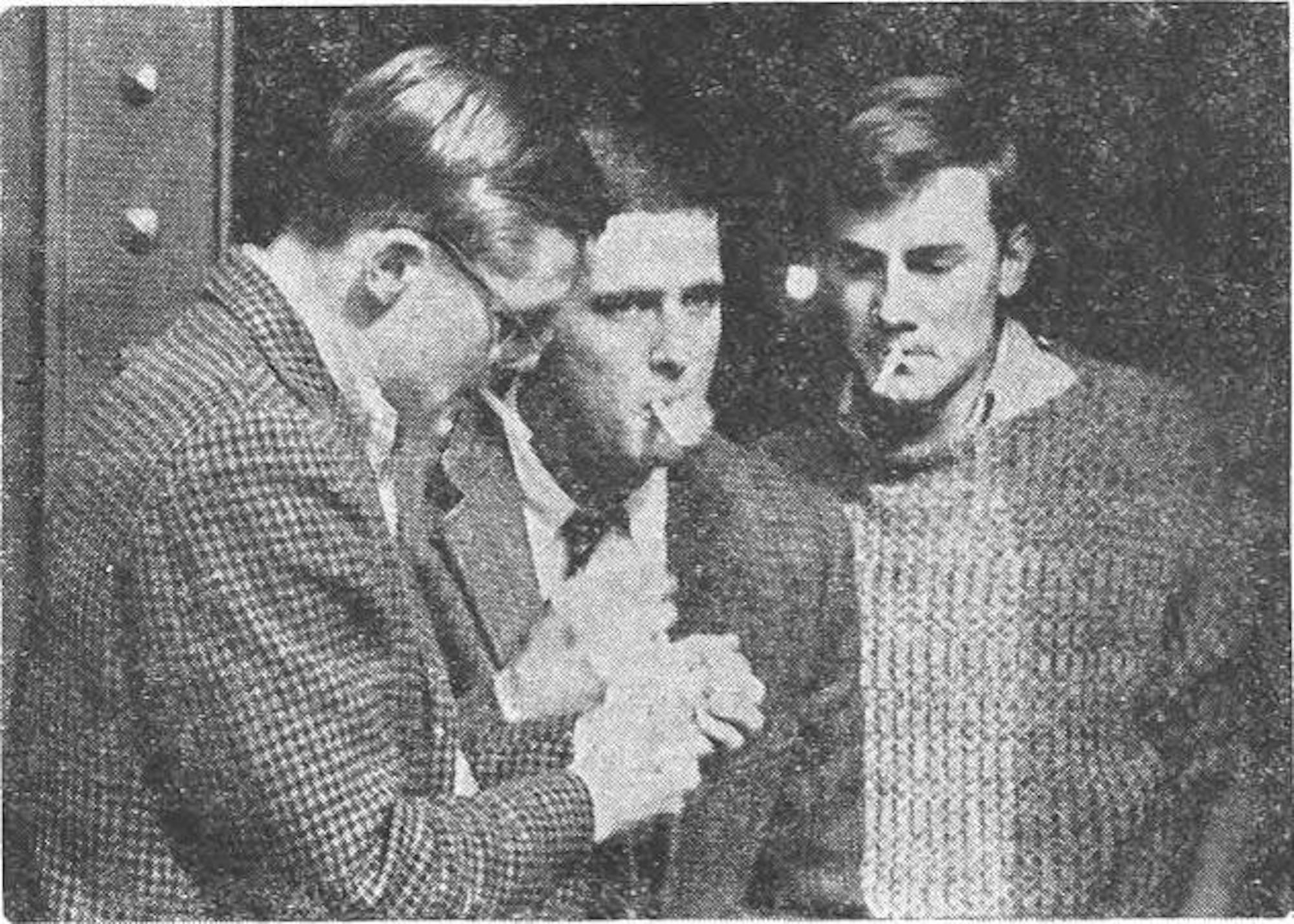 Black and white photograph of men smoking.