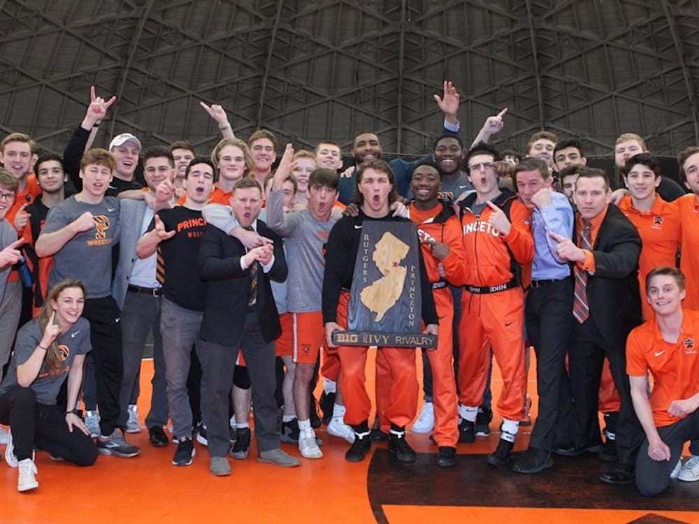 Wrestling poses with the B1G-Ivy trophy.
Photo credit: Beverly Schaefer, GoPrincetonTigers.