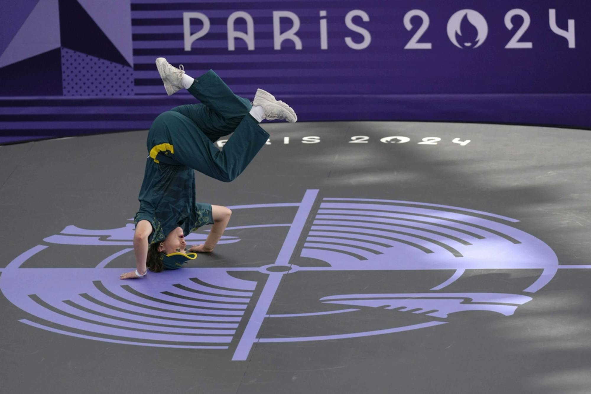 Australian breakdancer Rachael Gunn "Raygun" doing a headstand at the Paris 2024 Olympics. 