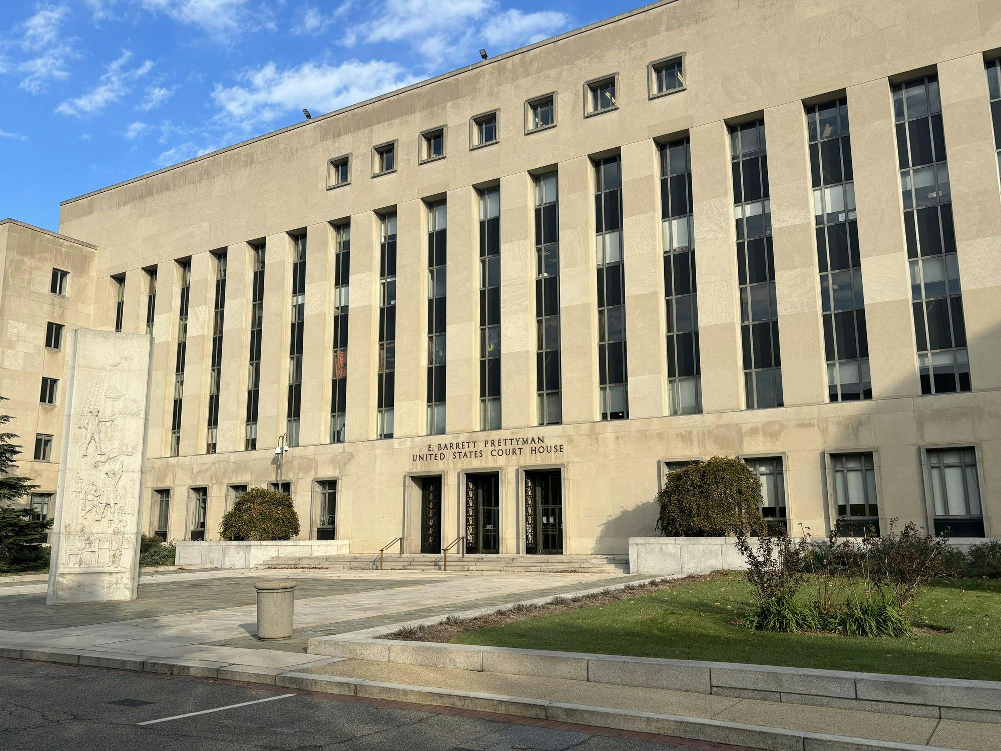 White, federal courthouse located in DC during the daytime.