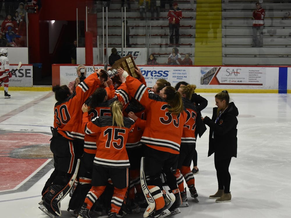 Women’s ice hockey celebrates with the ECAC trophy after winning their first ECAC championship in program history.
Owen Tedford/The Daily Princetonian