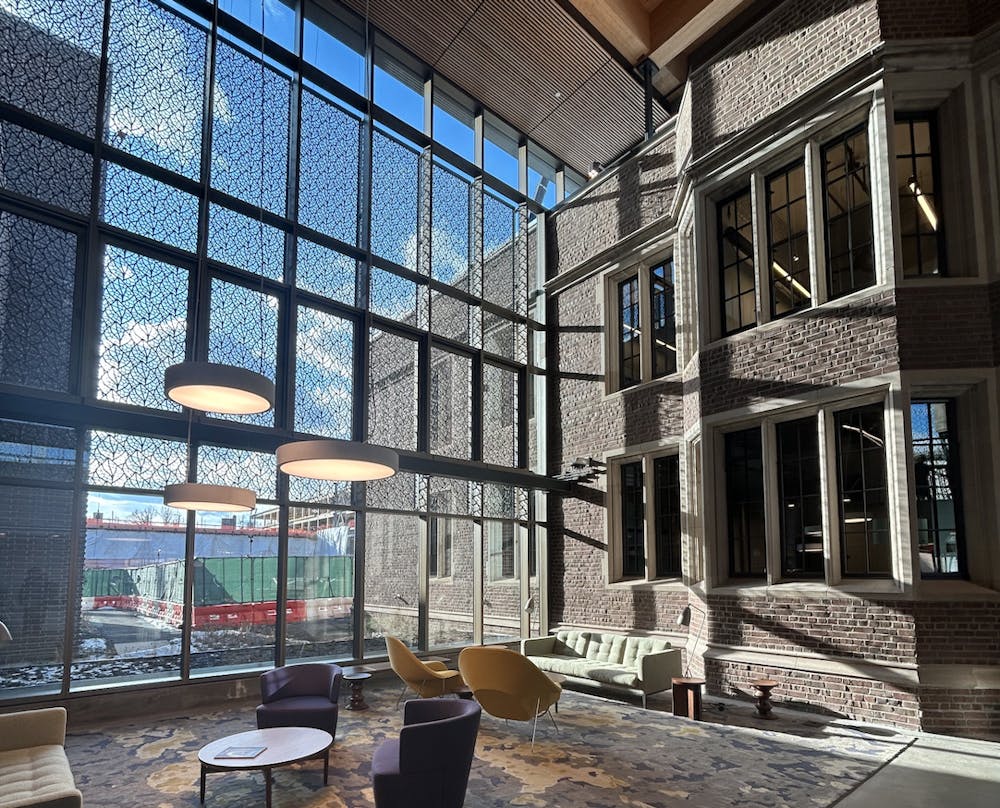 A brick building (Frist Health Center) with large windows, photo taken from the interior.