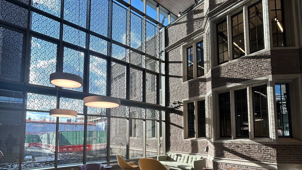 A brick building (Frist Health Center) with large windows, photo taken from the interior.