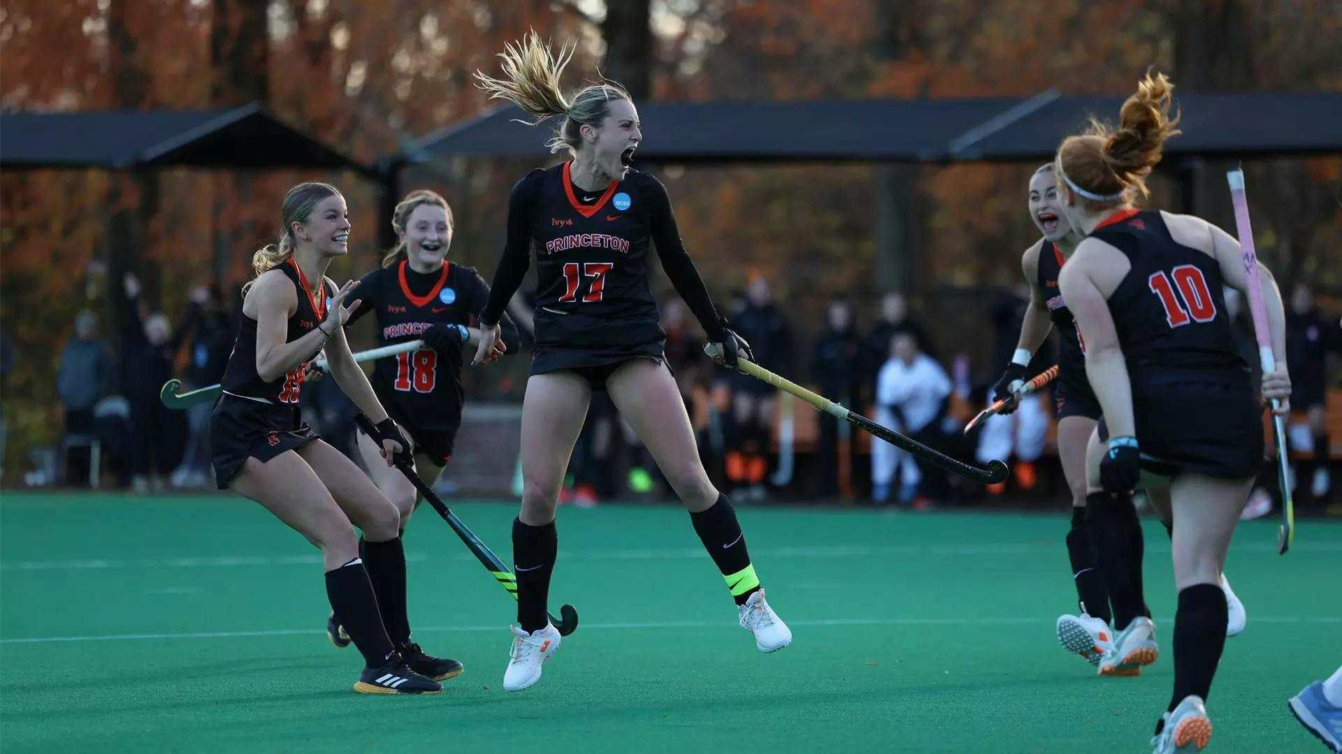 Field Hockey players celebrate.