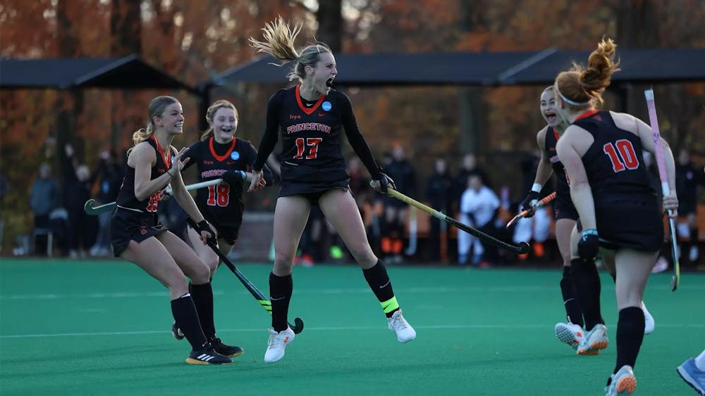 Field Hockey players celebrate.