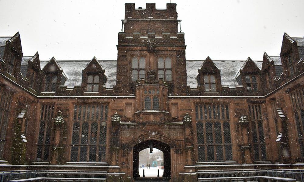 Inner courtyard of a brown building on a snowy day.