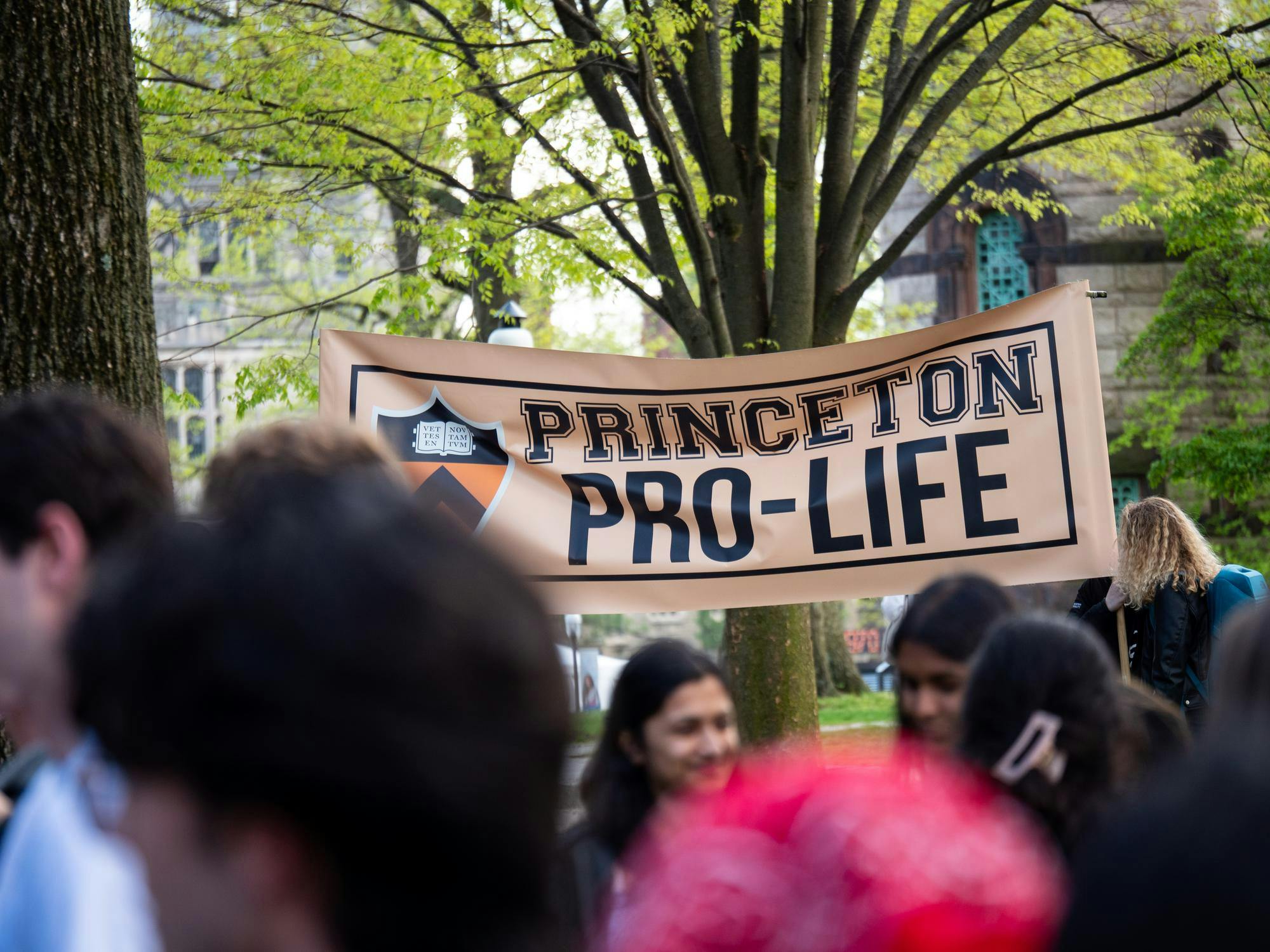 A large banner that reads "Princeton Pro-Life," with a blurred group of students in the foreground