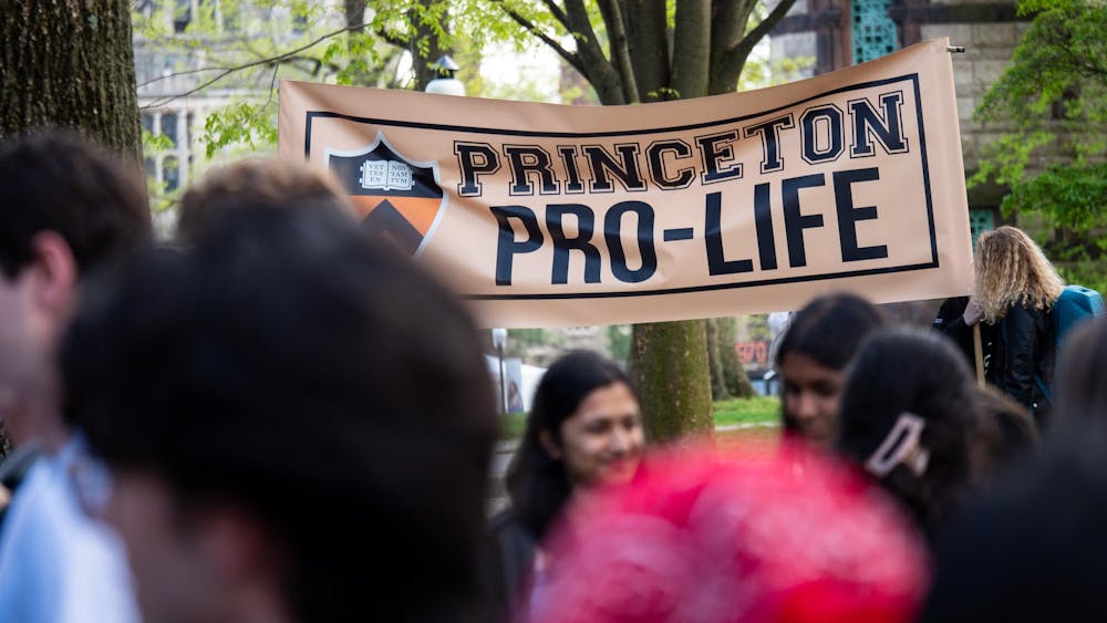 A large banner that reads "Princeton Pro-Life," with a blurred group of students in the foreground