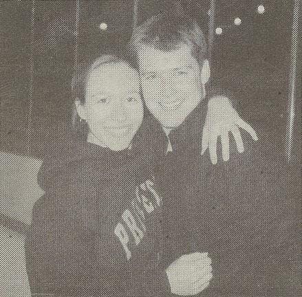 A black and white photograph of Jessica Falencki hugging her soon-to-be husband, Joe Falencki