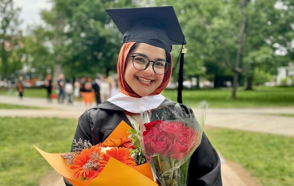 Mahya smiles at her graduation. 