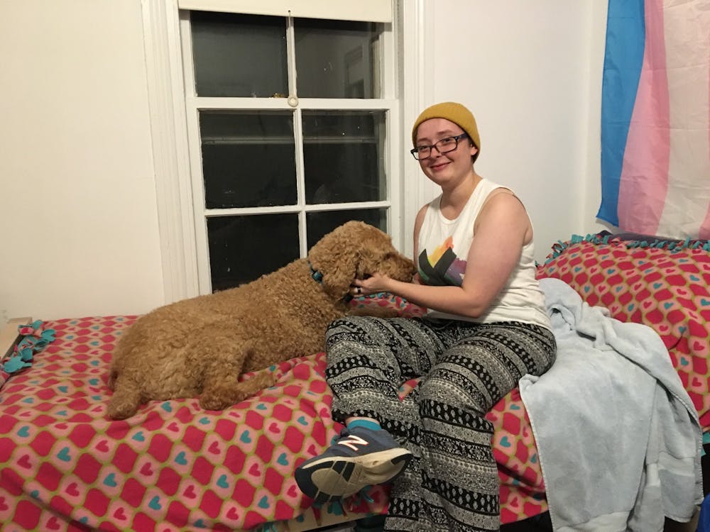 K Stiefel with their emotional support animal, Scarlet.&nbsp;
Photo Credit: Mindy Burton / The Daily Princetonian