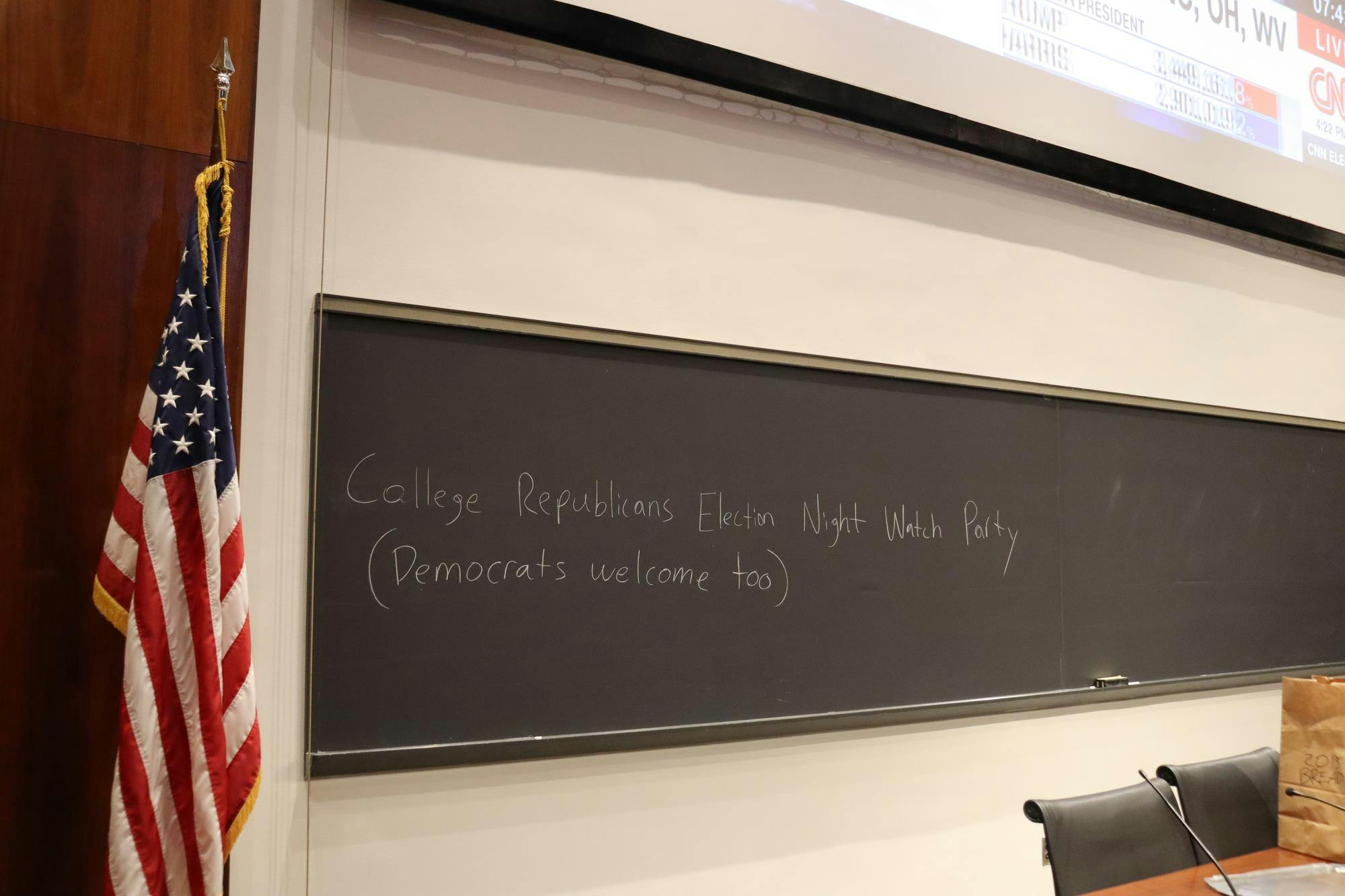 A large chalkboard reads "College Republicans Election Night Watch Party (Democrats welcome too)"