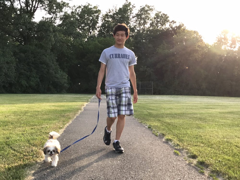 Kevin Chang '23 with Dog.JPG