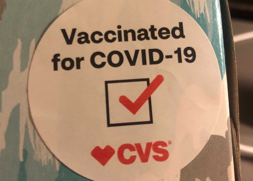 <h5>A sticker handed out after a COVID-19 vaccination at CVS</h5>
<h6>Celia Buchband / The Daily Princetonian</h6>