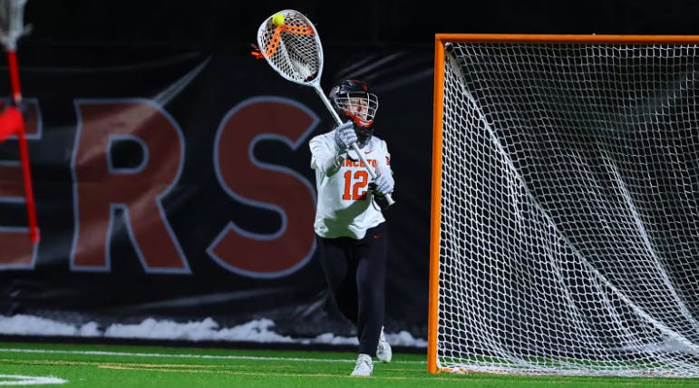 Princeton women's lacrosse goalie making a save.