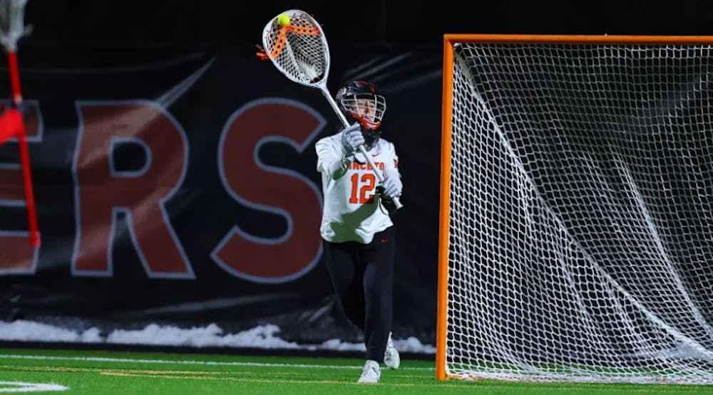 Princeton women's lacrosse goalie making a save.