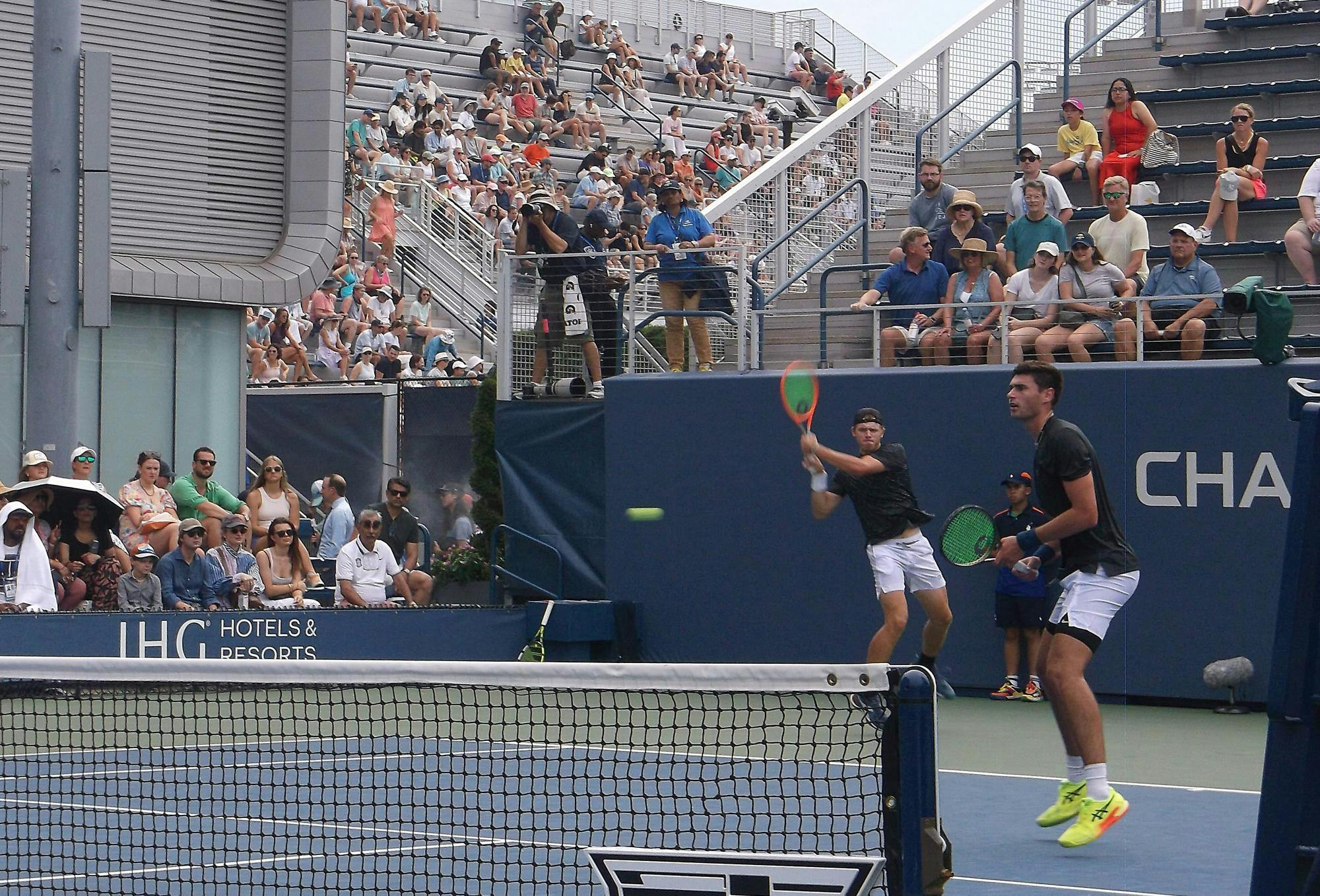 Man in black shirt hits backhand