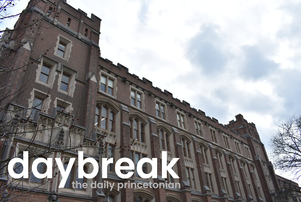 An old gothically styled building and light blue sky. Text on top of the building reads "Daybreak: the daily Princetonian"