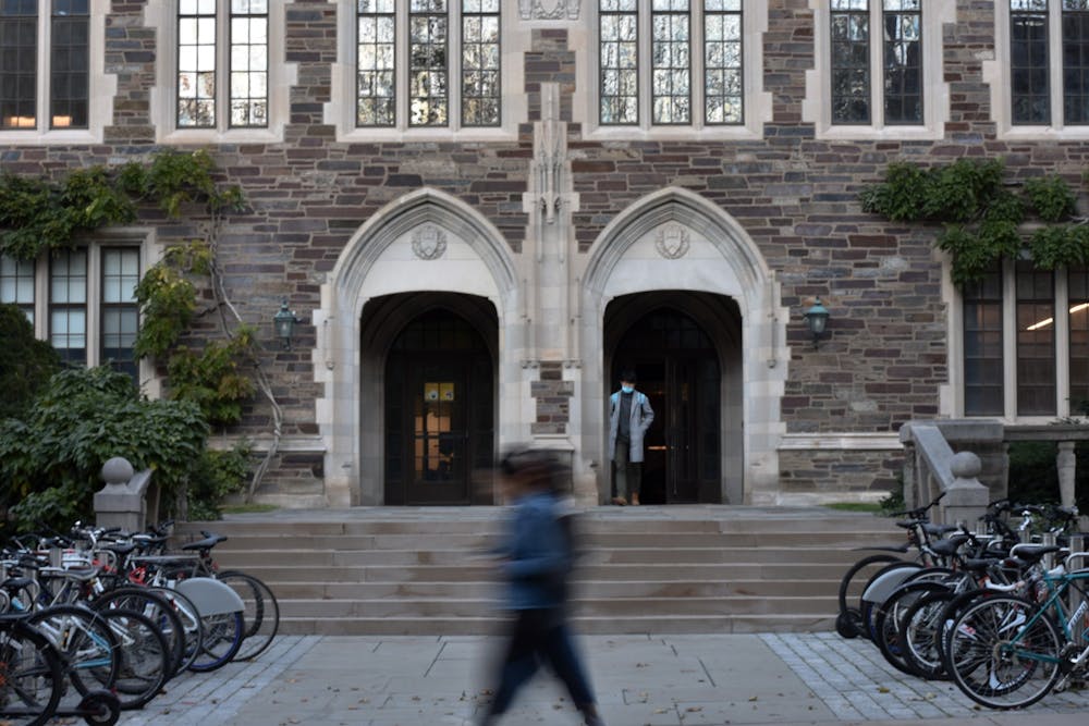Students walk past the entrance of the Julis Romo Rabinowitz building.