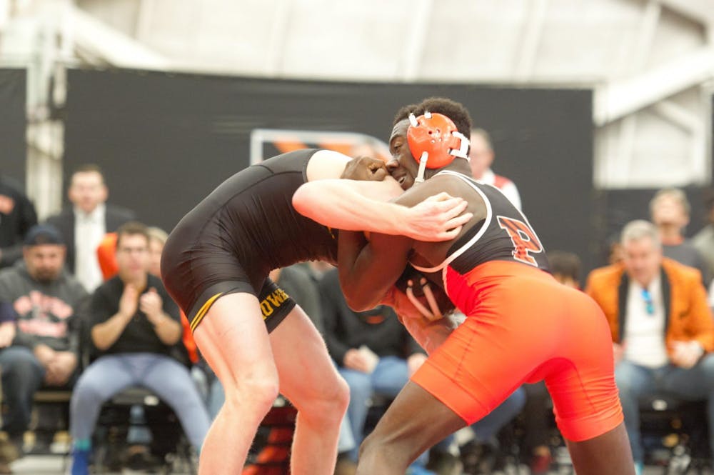 <p>No. 9 sophomore Quincy Monday, on his way to upsetting Iowa’s no. 4 Kaleb Young.</p>
<h6>Photo Credit: Jack Graham / The Daily Princetonian</h6>