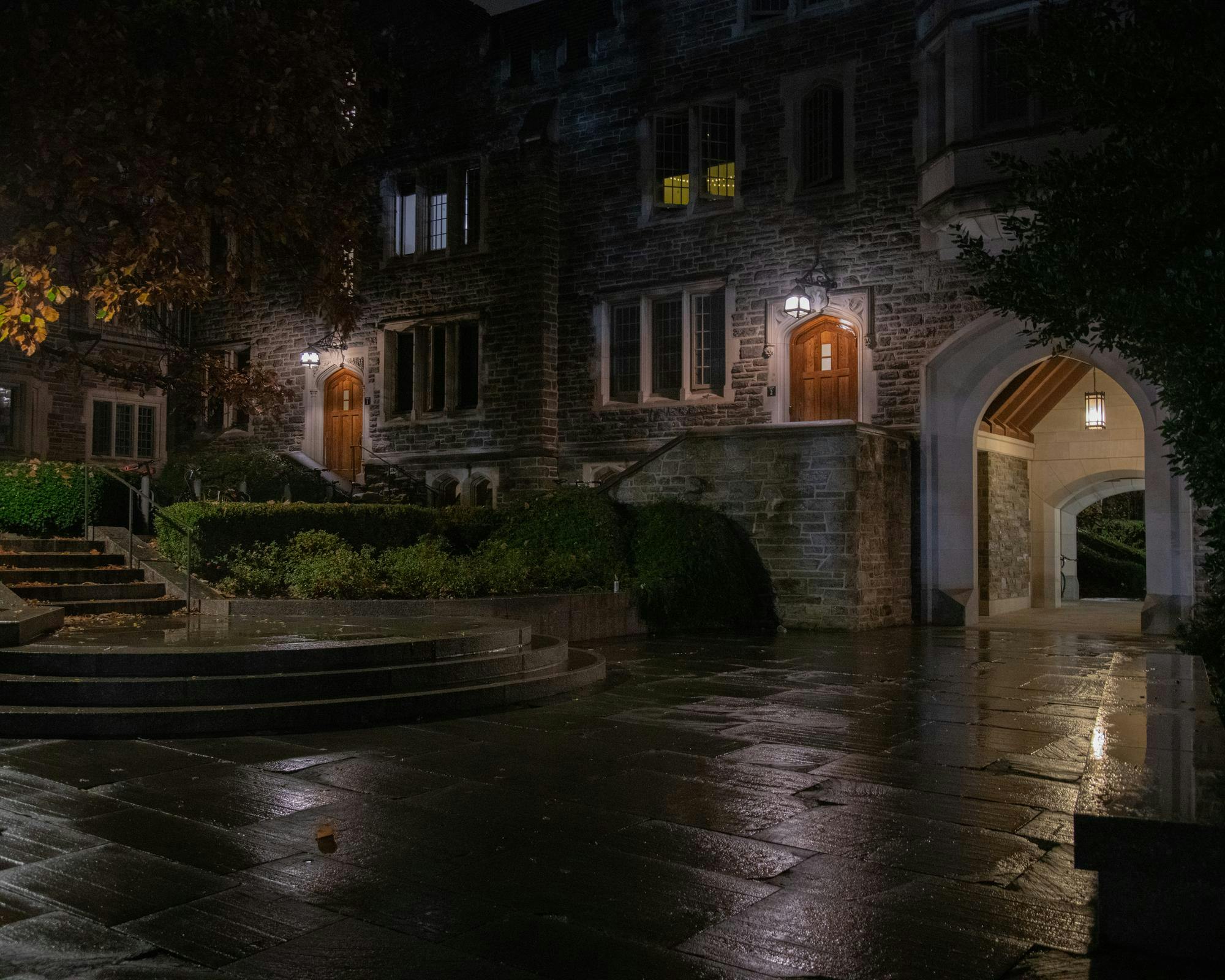 Gothic University building with lighted doorways.