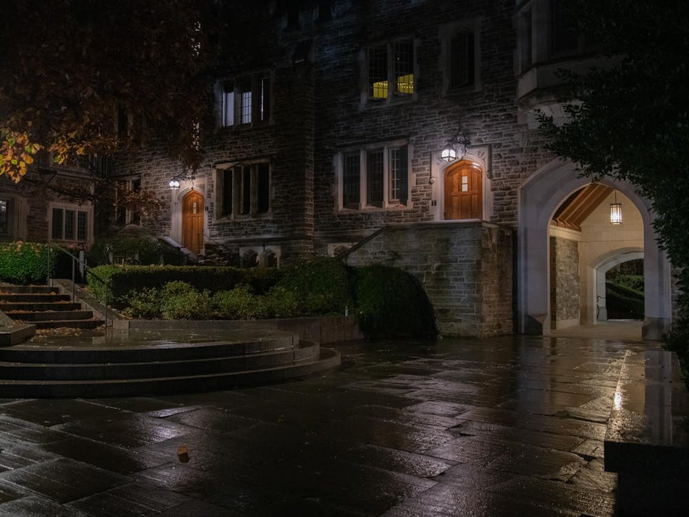 Gothic University building with lighted doorways.