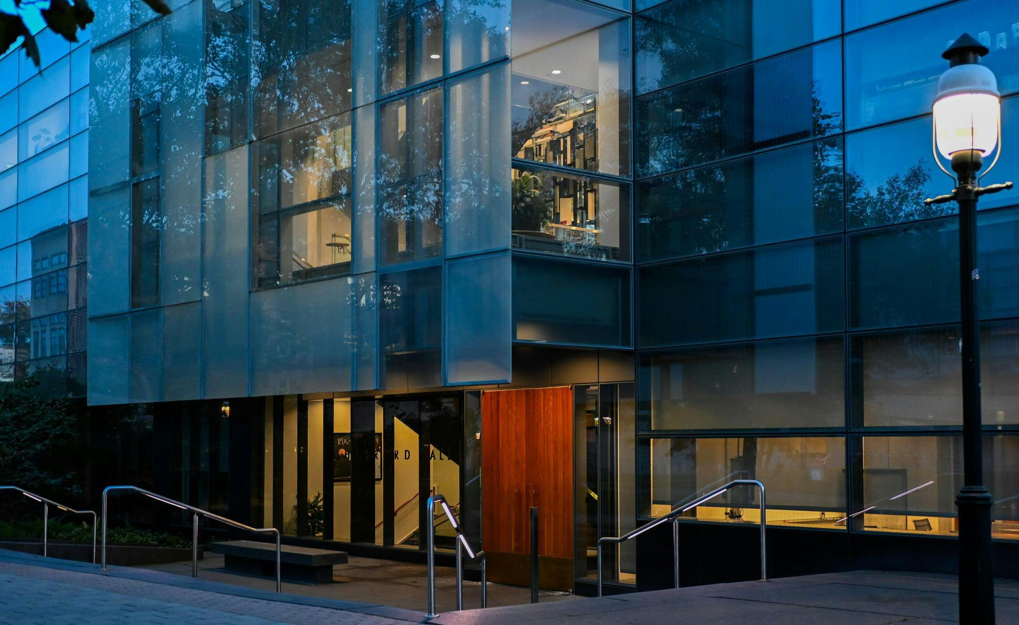 The door to Sherrerd Hall is in the center of the blue-tinted photo.