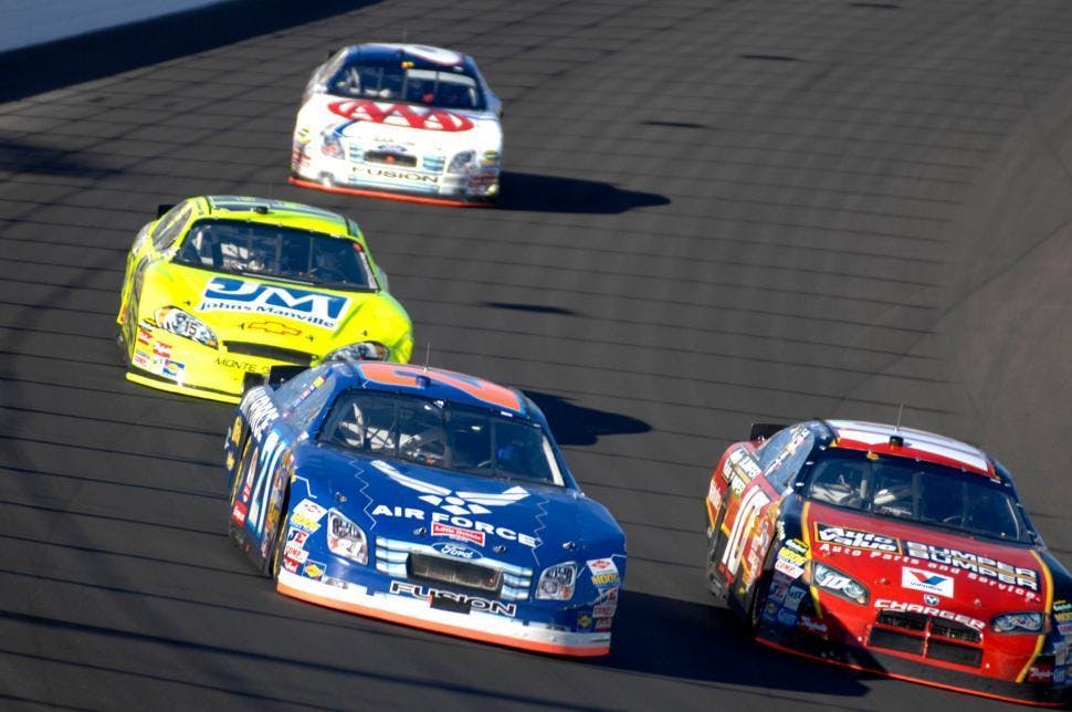 group-of-cars-racing-around-a-track.jpg