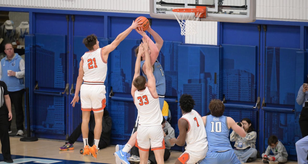Princeton and Columbia men's basketball players on the court.