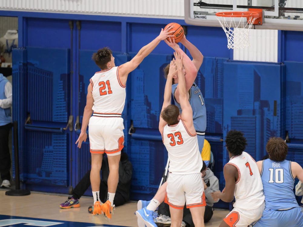Princeton and Columbia men's basketball players on the court.