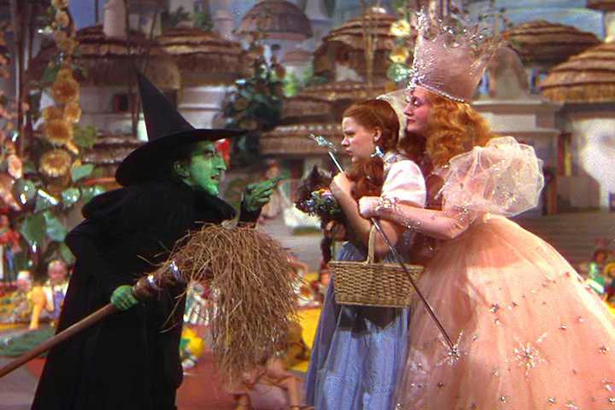 A scene from the movie "The Wizard of Oz" (1939) where Dorothy and Glinda are confronted by the Wicked Witch of the West.