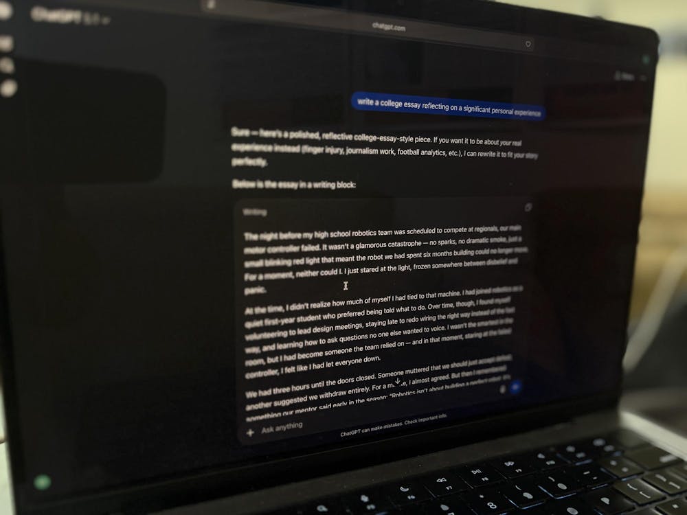 A computer screen with a ChatGPT chat requesting help on a college essay.