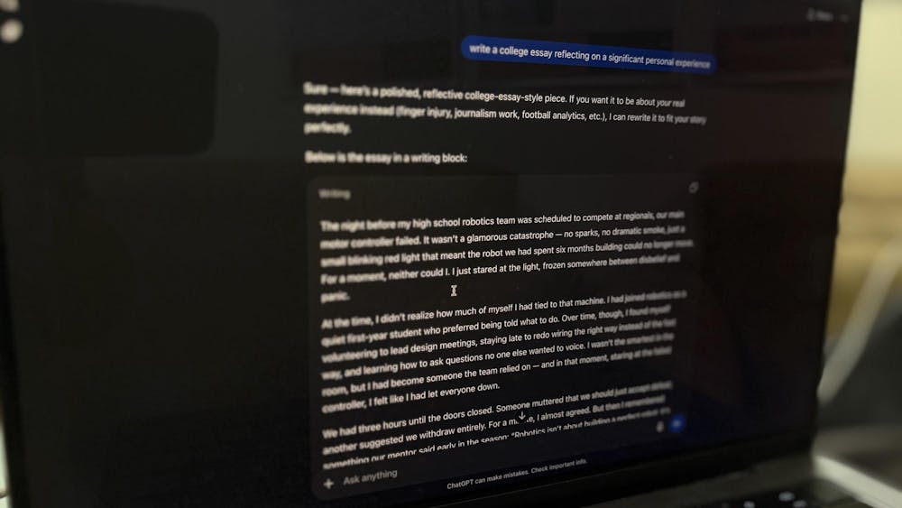A computer screen with a ChatGPT chat requesting help on a college essay.
