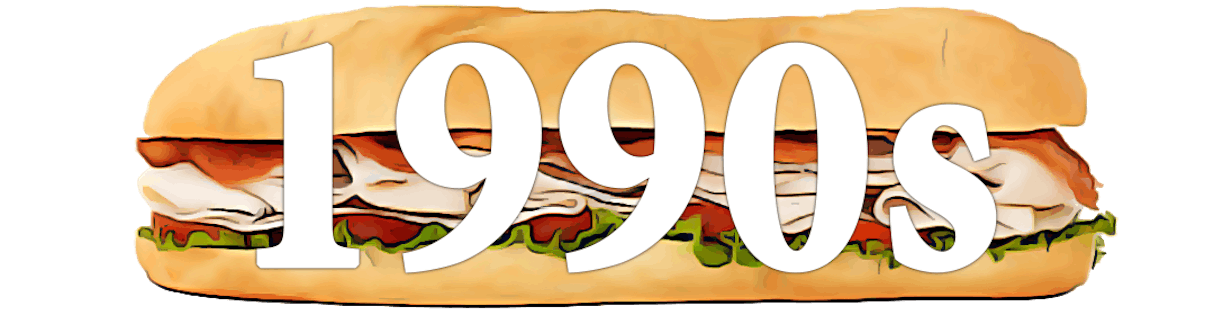 A large hoagie sandwich with the text "1990s" overlaid in white.