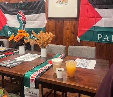 Three drinks on table with Palestinian flags 