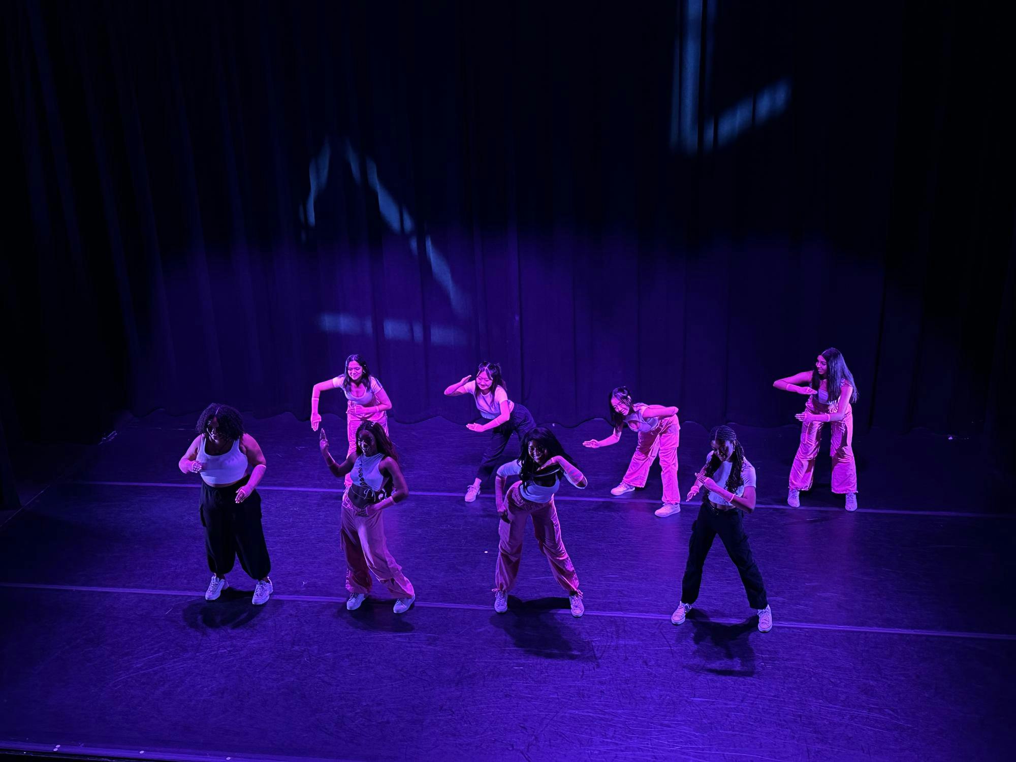Dancers of the Black Arts Company dance to "Barbie Girl" by Aqua, Ice Spice, and Nicki Minaj in Frist Theater to purple lighting.