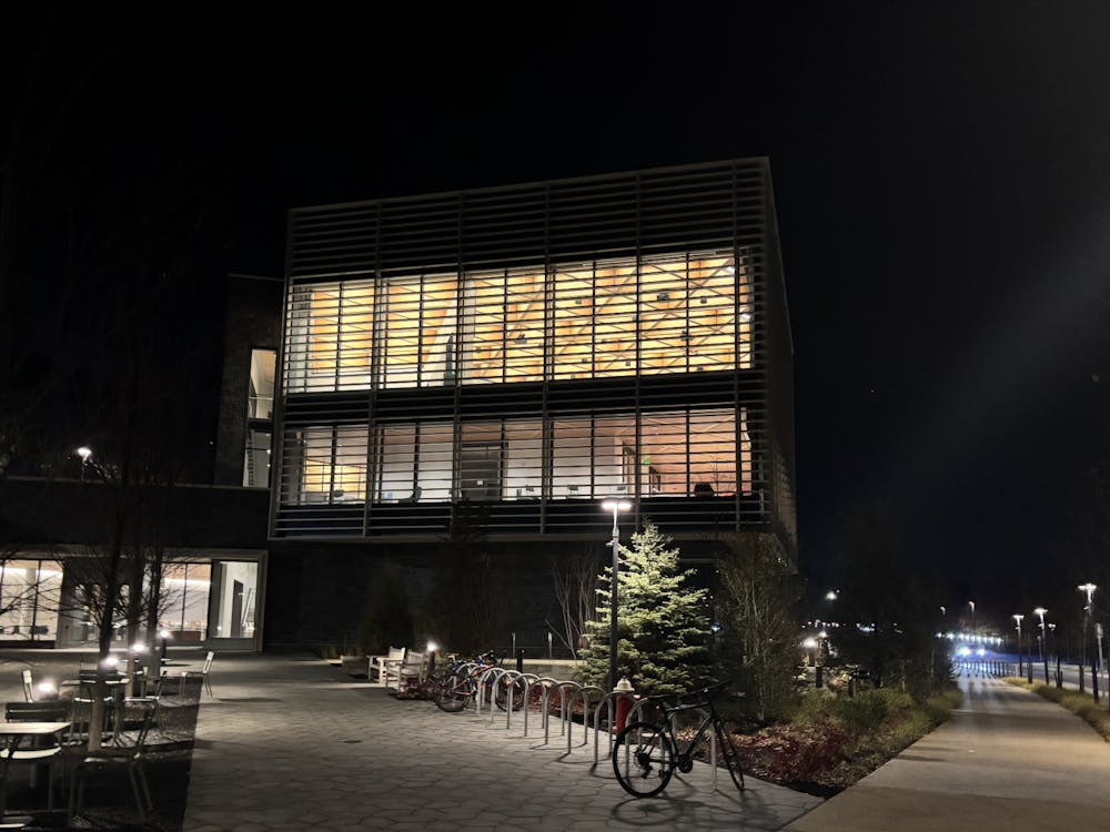 An outside view of Commons Library in the ES & SEAS complex at night.