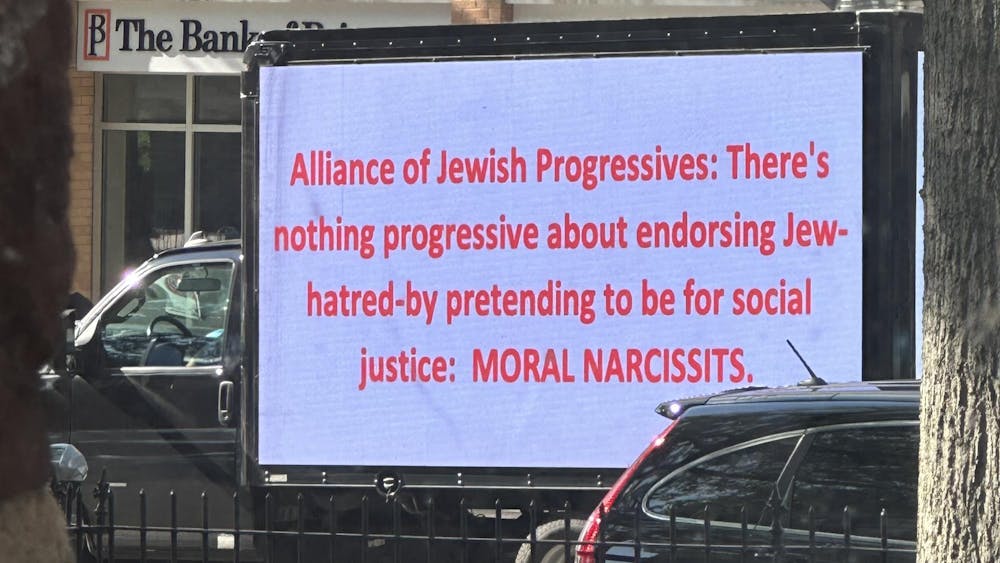 Truck with digital screen that reads "Alliance of Jewish Progressives: There's nothing progressive about endorsing Jew-hatred-by pretending to be for social justice: MORAL NARCISSISTS."