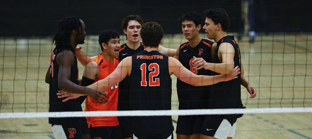 Princeton men’s volleyball in a huddle.