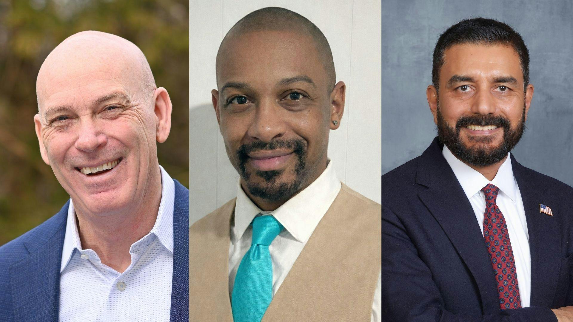 Three men in suits.